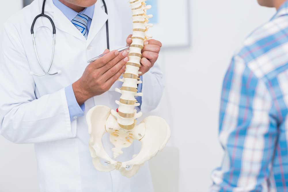 Doctor assesses spine